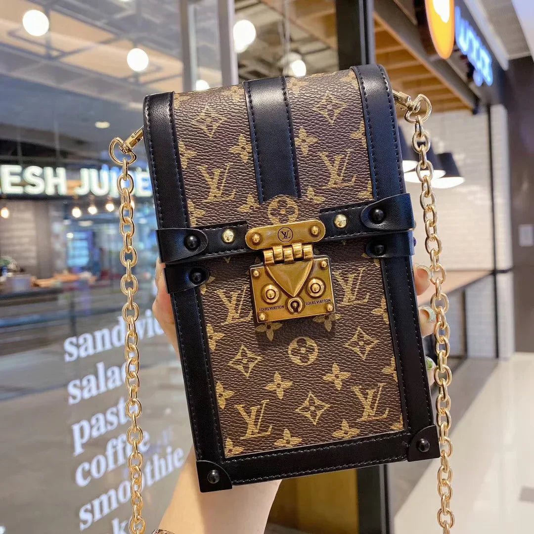 Monogram canvas en lederen kofferbak crossbody tas