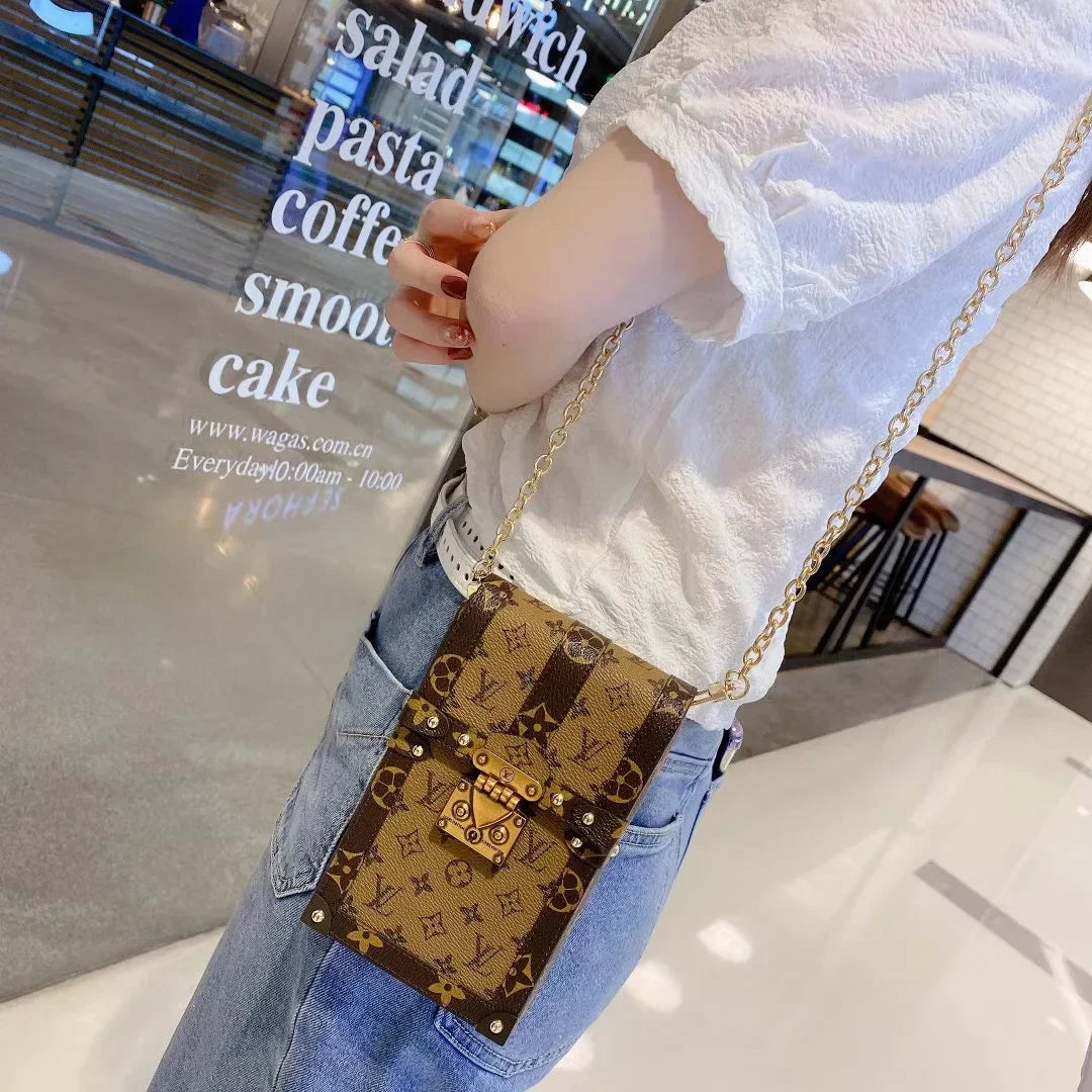 Monogram canvas en lederen kofferbak crossbody tas