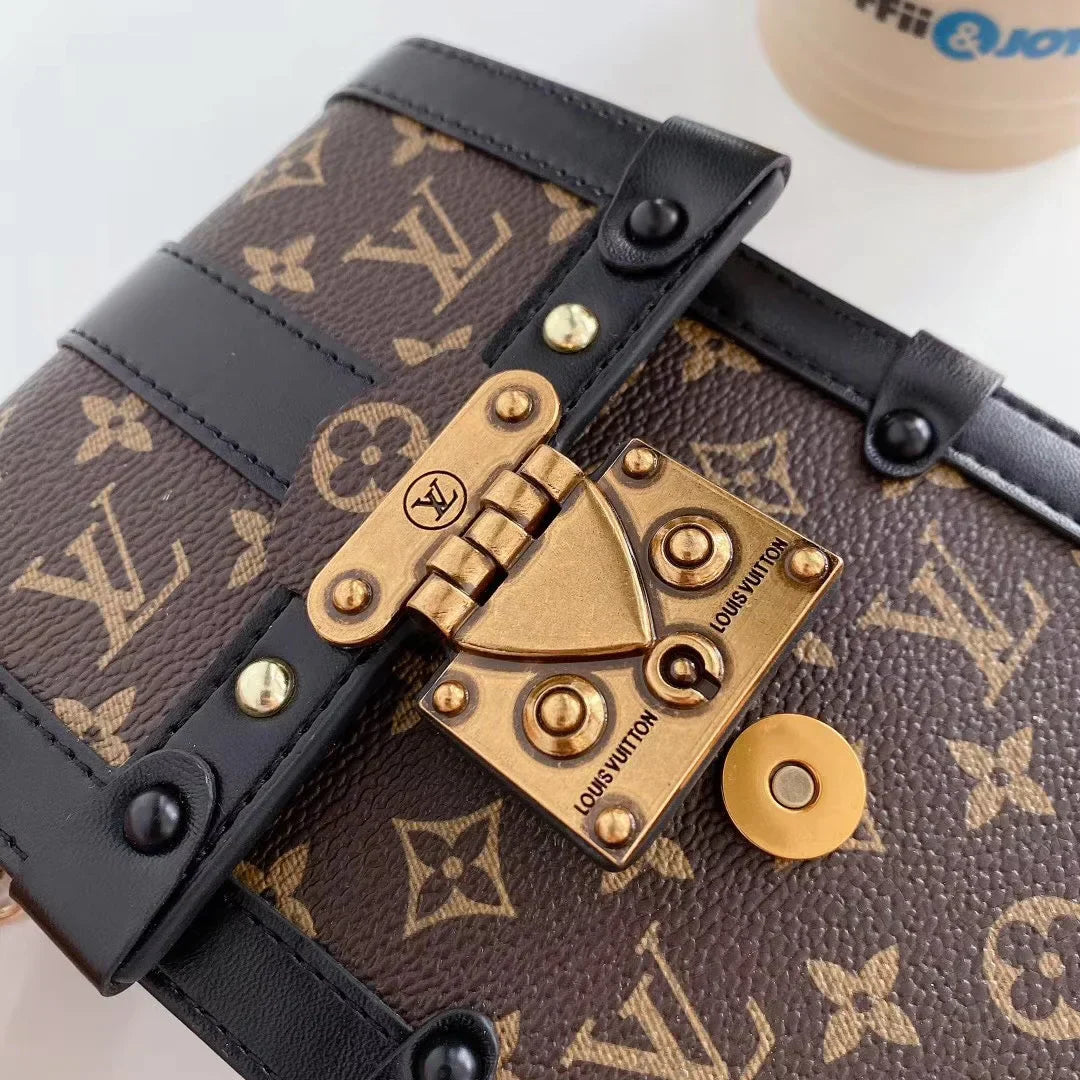 Monogram canvas en lederen kofferbak crossbody tas