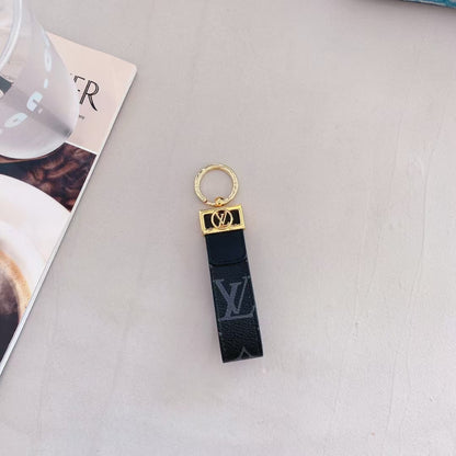Luxusní klíčenka monogramu LV s elegantním zlatým přízvukem